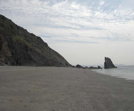 Distant view of a stack, showing its relationship to the beach and cliffline